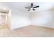 Spacious bedroom with fresh paint, light wood flooring, and a ceiling fan at 50 Armstrong Cir, Henderson, NV 89015
