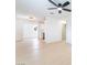 Open-concept living room featuring hardwood floors and freshly painted walls, leading to the kitchen at 50 Armstrong Cir, Henderson, NV 89015
