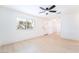 Bright, airy living room featuring fresh paint, light wood flooring, and a ceiling fan at 50 Armstrong Cir, Henderson, NV 89015