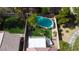 Aerial view of backyard with a pool, patio and well-maintained artificial grass at 5004 Ironhorse Ranch Ave, Las Vegas, NV 89131
