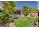 Landscaped backyard featuring artificial turf, stone features, and above ground pool at 5004 Ironhorse Ranch Ave, Las Vegas, NV 89131