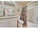 Bathroom features a granite vanity top and a shower-over-tub combination at 5004 Ironhorse Ranch Ave, Las Vegas, NV 89131