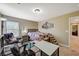 Bedroom with plush chair, desk, and a cozy bed creates a relaxing atmosphere at 5004 Ironhorse Ranch Ave, Las Vegas, NV 89131