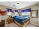 Bedroom featuring natural light from windows and a wooden bed frame at 5004 Ironhorse Ranch Ave, Las Vegas, NV 89131