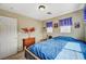 Bedroom with neutral walls, carpet floors, and a window letting in natural light at 5004 Ironhorse Ranch Ave, Las Vegas, NV 89131