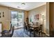 Warm and inviting dining area with outdoor access, hardwood floors, and adjacent kitchen access at 5004 Ironhorse Ranch Ave, Las Vegas, NV 89131