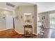 Inviting entryway featuring hardwood floors, neutral walls, and a view into the adjacent kitchen and dining area at 5004 Ironhorse Ranch Ave, Las Vegas, NV 89131
