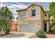 Two-story home featuring a two-car garage, desert landscaping, and a tile roof at 5004 Ironhorse Ranch Ave, Las Vegas, NV 89131