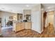 Open-concept kitchen with granite countertops, wood cabinets, and seamless transition to the dining area at 5004 Ironhorse Ranch Ave, Las Vegas, NV 89131