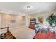Upstairs living room with desk, bookshelf, and staircase offers a functional space at 5004 Ironhorse Ranch Ave, Las Vegas, NV 89131