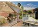 Inviting covered patio with a relaxing hammock, outdoor seating, and view of pool area at 5004 Ironhorse Ranch Ave, Las Vegas, NV 89131