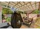 Covered patio featuring a grill, seating, and a hammock for relaxing outdoors at 5004 Ironhorse Ranch Ave, Las Vegas, NV 89131