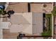 This aerial view showcases the home's roof, yard with an outdoor structure, landscaping, and proximity to the street at 5028 Crying Heart St, North Las Vegas, NV 89031