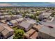 Elevated perspective capturing the residence, backyard, pergola, turf, amid a desert-landscaped community at 5028 Crying Heart St, North Las Vegas, NV 89031
