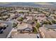 Scenic aerial view highlighting the backyard with a pergola, and artificial turf within a desert community setting at 5028 Crying Heart St, North Las Vegas, NV 89031