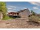 Backyard featuring a covered patio, gravel and small shrubs at 5028 Crying Heart St, North Las Vegas, NV 89031