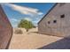 Backyard featuring a gravel yard and block fence at 5028 Crying Heart St, North Las Vegas, NV 89031