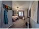 Cozy bedroom with neutral tones, carpeted floors, a ceiling fan, and window coverings at 5028 Crying Heart St, North Las Vegas, NV 89031