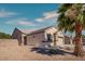 Lovely single-story home featuring a two-car garage and desert landscaping at 5028 Crying Heart St, North Las Vegas, NV 89031
