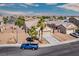 Beautiful single-story house featuring desert landscaping, a two-car garage, and views of the surrounding neighborhood at 5028 Crying Heart St, North Las Vegas, NV 89031