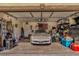 Spacious garage featuring a classic Corvette, ample storage space, and an organized layout at 5028 Crying Heart St, North Las Vegas, NV 89031