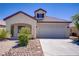 Charming single story home featuring a two-car garage and low-maintenance landscaping in front at 5240 Adorato Dr, North Las Vegas, NV 89031