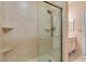 A modern glass shower featuring tile walls and built-in shelving at 5250 S Rainbow Blvd # 2101, Las Vegas, NV 89118