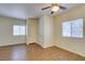 Light-filled bedroom with wood floors, ceiling fan, and closet space at 5250 S Rainbow Blvd # 2101, Las Vegas, NV 89118