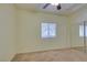 A cozy bedroom features neutral carpet, a ceiling fan, and mirrored closet doors at 5250 S Rainbow Blvd # 2101, Las Vegas, NV 89118