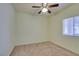 Cozy bedroom features a ceiling fan and a window with blinds for natural light at 5250 S Rainbow Blvd # 2101, Las Vegas, NV 89118