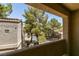 A lovely view from the covered balcony overlooking mature trees and buildings at 5250 S Rainbow Blvd # 2101, Las Vegas, NV 89118
