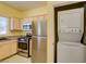 Modern kitchen with stainless steel appliances and an in-unit washer and dryer at 5250 S Rainbow Blvd # 2101, Las Vegas, NV 89118