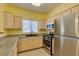 Kitchen featuring stainless steel appliances, a black sink, and granite countertops at 5250 S Rainbow Blvd # 2101, Las Vegas, NV 89118