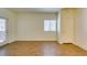 Bright living room with wood floors, a window, and a sliding glass door at 5250 S Rainbow Blvd # 2101, Las Vegas, NV 89118