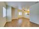 Bright living room with wood floors, large windows, and a front door entrance at 5250 S Rainbow Blvd # 2101, Las Vegas, NV 89118