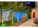Beautiful backyard featuring elegant landscaping, a decorative water feature, and a cozy seating area at 527 Serenity Point Dr, Henderson, NV 89012