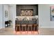 Stylish bar area with unique decor, seating, built-in shelving and under-counter lighting at 527 Serenity Point Dr, Henderson, NV 89012