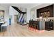 Contemporary bar area featuring custom shelving and seating, complemented by modern decor at 527 Serenity Point Dr, Henderson, NV 89012
