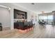 Chic bar area with display shelving, seating, and modern lighting near dining area at 527 Serenity Point Dr, Henderson, NV 89012
