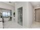 Bright bathroom boasts a glass shower, large tub, and elegant marble flooring at 527 Serenity Point Dr, Henderson, NV 89012