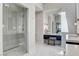 Bathroom featuring vanity, walk-in glass shower, and white marble floors at 527 Serenity Point Dr, Henderson, NV 89012