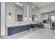 This upscale bathroom features double vanities, marble floors, and an elegant soaking tub at 527 Serenity Point Dr, Henderson, NV 89012