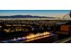 Breathtaking city view with fire pit, perfect for entertaining guests outdoors at night at 527 Serenity Point Dr, Henderson, NV 89012
