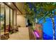 Serene courtyard featuring a water feature, ambient lighting, and comfortable seating at 527 Serenity Point Dr, Henderson, NV 89012