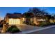 Contemporary home with a paved driveway, three-car garage, and neatly landscaped front yard at 527 Serenity Point Dr, Henderson, NV 89012