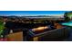 Outdoor seating area with a fire pit and panoramic city views, ideal for relaxing and entertaining at 527 Serenity Point Dr, Henderson, NV 89012
