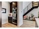Stainless steel oven tower with adjacent cabinets near a modern staircase with planters at 527 Serenity Point Dr, Henderson, NV 89012