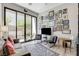 Cozy living room with eclectic wall art, a comfortable sofa, and natural light, perfect for relaxation and entertainment at 527 Serenity Point Dr, Henderson, NV 89012