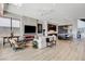 Open-concept living room featuring fireplace, modern decor, and an adjacent kitchen area at 527 Serenity Point Dr, Henderson, NV 89012