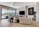Spacious living room with a fireplace, large windows, and neutral colored furniture at 527 Serenity Point Dr, Henderson, NV 89012